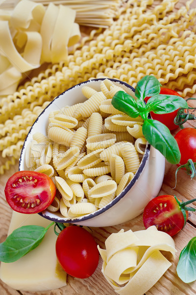 Pasta, tomato and basil Stock photo © Karaidel