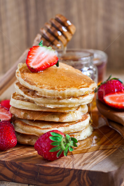 Stock photo: Pancakes with strawberry and honey