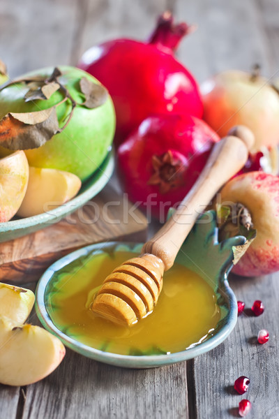 Pomegranate, apples and honey Stock photo © Karaidel