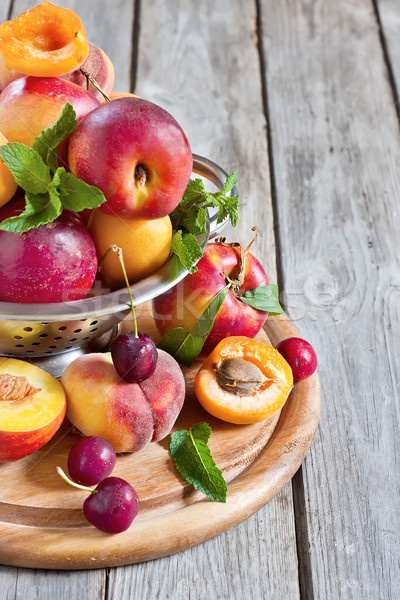 Apricots, nectarines and saturn peaches background Stock photo © Karaidel
