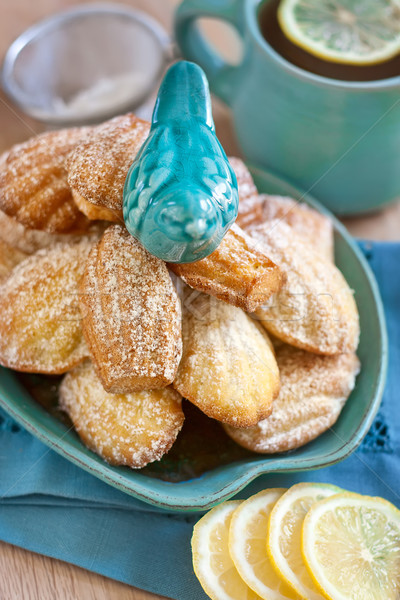 Madeleines with tea Stock photo © Karaidel