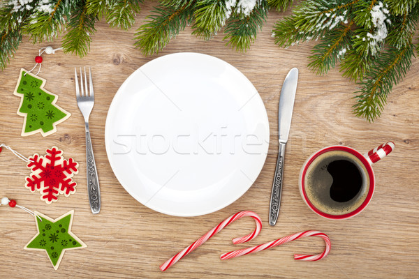 Stock photo: Empty plate, coffee cup and christmas decor