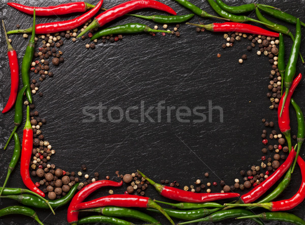 Chilipaprika borsszem fekete kő asztal copy space Stock fotó © karandaev