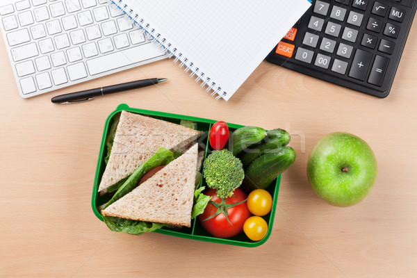 Stock photo: Office desk with supplies and lunch box