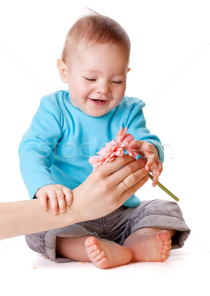 small baby touching pink