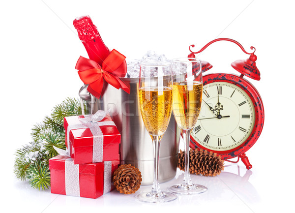 Champagne, gift boxes and christmas clock Stock photo © karandaev
