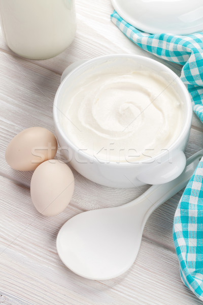 Stock photo: Sour cream in a bowl and eggs