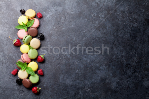 Colorful macaroons and berries Stock photo © karandaev