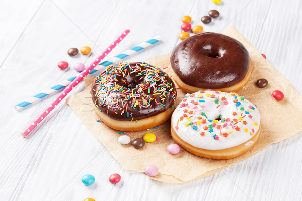 Donuts and candies Stock photo © karandaev