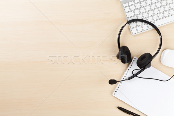 Office desk with headset and pc Stock photo © karandaev