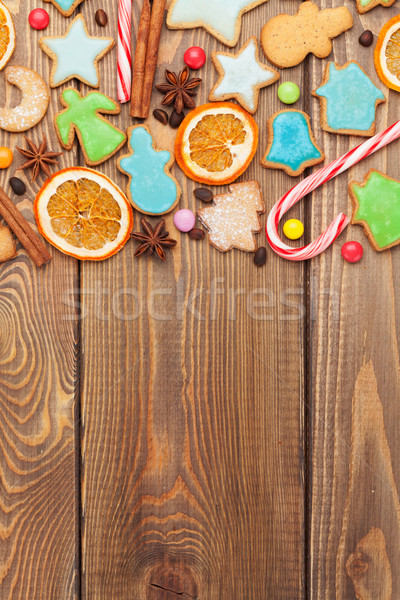 Christmas wooden background with candies, spices, gingerbread co Stock photo © karandaev