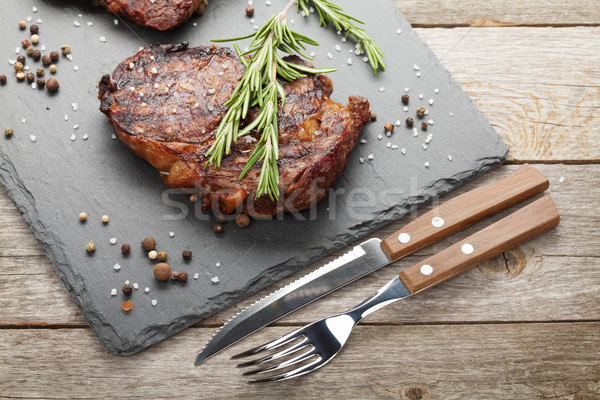 Beef steaks with rosemary and spices Stock photo © karandaev