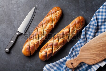 Сток-фото: хлеб · ножом · темно · каменные · таблице