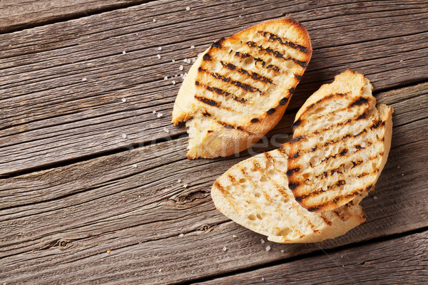 Brindis pan sal mesa de madera superior vista Foto stock © karandaev
