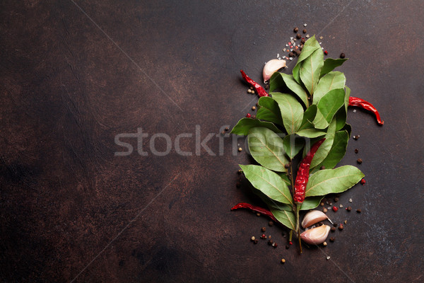 Stock photo: Herbs and spices on stone table