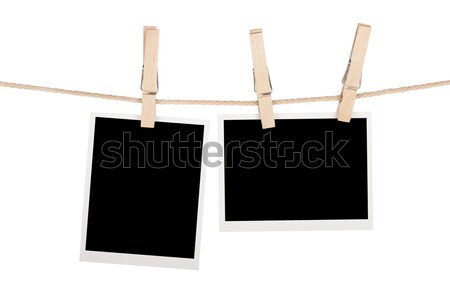 Blank photos hanging on clothesline Stock photo © karandaev