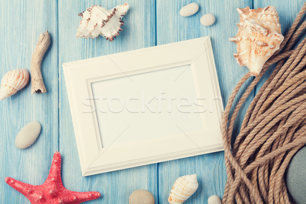 Sea vacation with blank photo frame, star fish and marine rope Stock photo © karandaev
