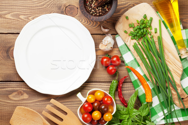 Cooking ingredients and empty plate Stock photo © karandaev