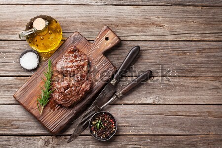 Grilled beef steak with rosemary, salt and pepper and wine Stock photo © karandaev