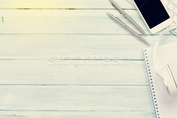 Stock photo: Headphones, phone and pc on wooden desk table