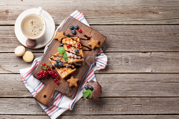 Coffee, sweets and waffles with berries Stock photo © karandaev