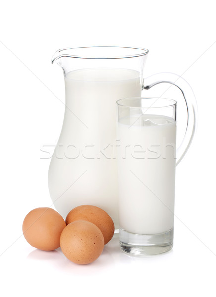 Milk jug, glass and eggs Stock photo © karandaev