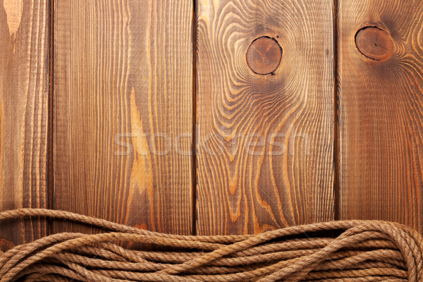 Wooden background with marine rope Stock photo © karandaev