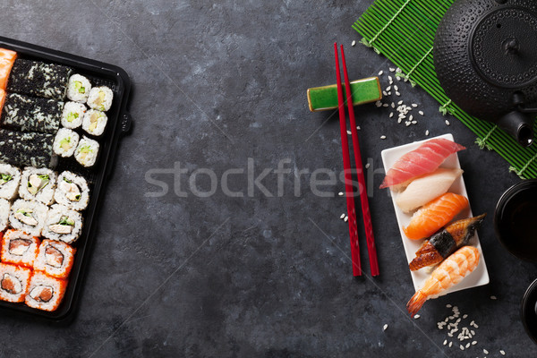 Set of sushi, maki and green tea Stock photo © karandaev