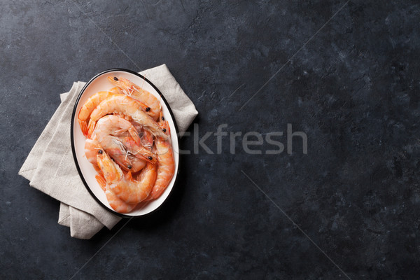 Fresh seafood on stone table. Shrimps Stock photo © karandaev