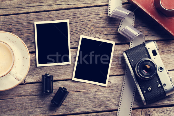 Vintage camera and blank photo frames Stock photo © karandaev