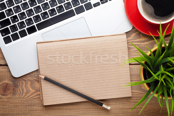 Stock photo: Office desk table with computer, supplies, coffee cup and flower