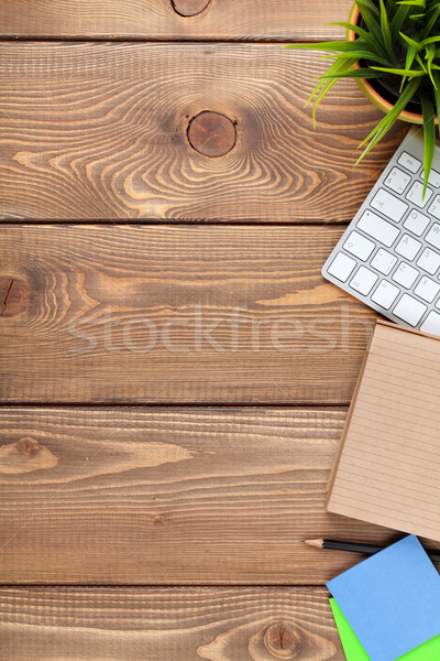 Office desk table with computer, supplies and flower Stock photo © karandaev