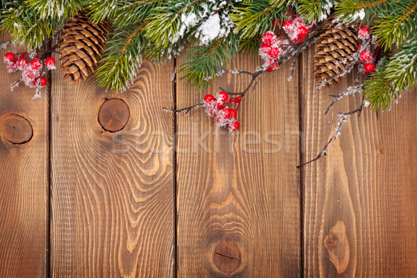Christmas wooden background with snow fir tree Stock photo © karandaev