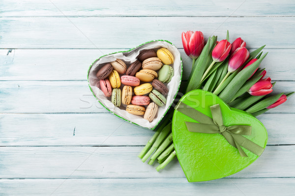 Red tulips and gift box with macaroons Stock photo © karandaev