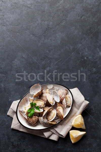 Fresh seafood bowl on stone table. Scallops Stock photo © karandaev
