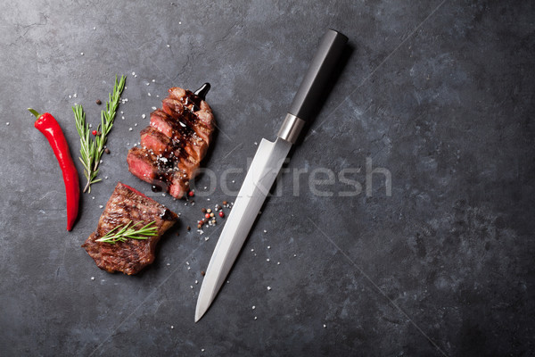 Grillezett szeletel bifsztek rozmaring kő asztal Stock fotó © karandaev