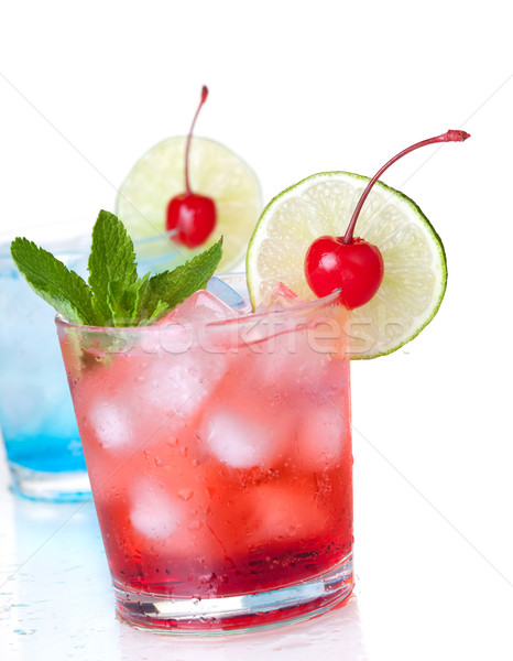 Two cocktails with lime slice and maraschino Stock photo © karandaev