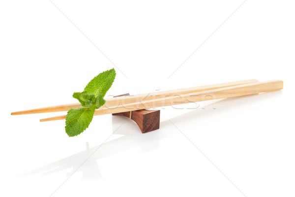 Sushi bacchette menta foglie isolato bianco Foto d'archivio © karandaev