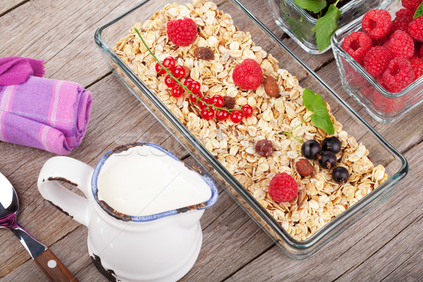 Healthy breakfast with muesli, milk and berries Stock photo © karandaev