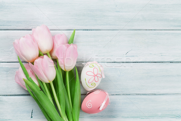 Easter eggs and pink tulips Stock photo © karandaev