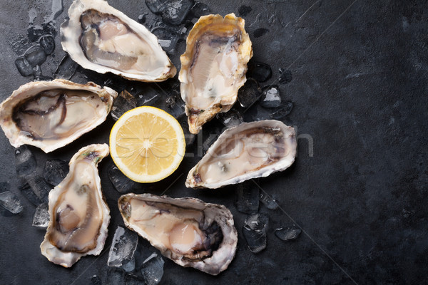 Oysters and lemon Stock photo © karandaev