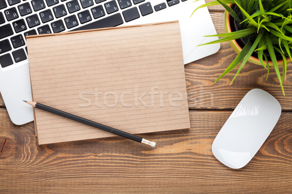 Office desk table with computer, supplies and flower Stock photo © karandaev