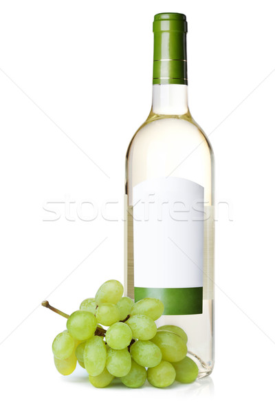 Stock photo: White wine in bottle with blank label and grapes