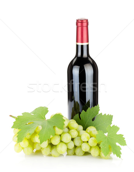 Red wine bottle and grapes Stock photo © karandaev