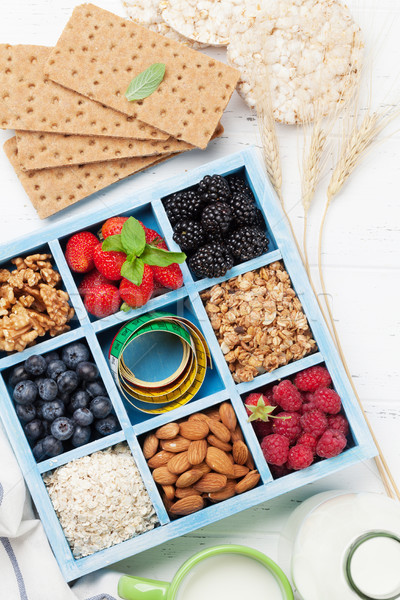 Healthy breakfast with muesli, berries and milk Stock photo © karandaev