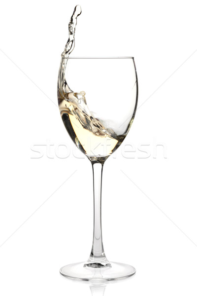 Splashing white wine in a glass Stock photo © karandaev