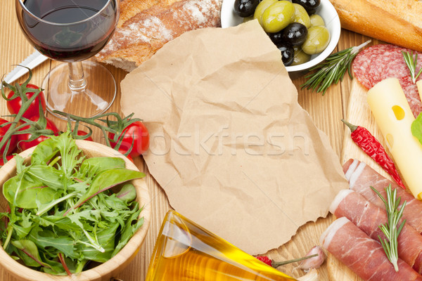 Stock photo: Red wine with cheese, prosciutto, bread, vegetables and spices