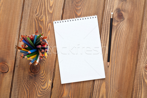 Office desk table with notepad and colorful pencils Stock photo © karandaev