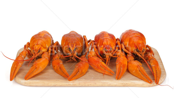 Stock photo: Boiled crayfishes on cutting board