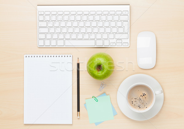 Stock photo: Office table with notepad, computer and coffee cup